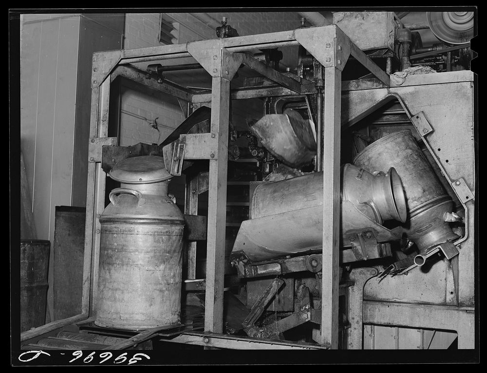 Milk cans coming out of sterilizer at the Dairymen's Creamery. Caldwell, Canyon County, Idaho by Russell Lee