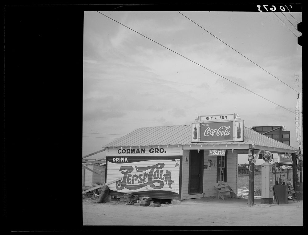 Gas station and store operated by tobacco farmer. On highway 15, about five miles north of Durham, North Carolina. Sourced…