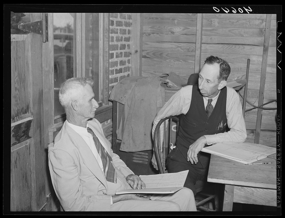 Two election officials at polling place on election day. Stem, Granville County, North Carolina. Sourced from the Library of…