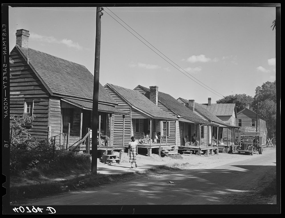 A street in the  quarter of Elizabeth City, North Carolina, where many of the migrants find lodging. In the background is…