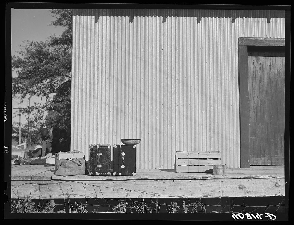 [Untitled photo, possibly related to: Warehouse that provides housing for a number of migratory agricultural workers. On the…