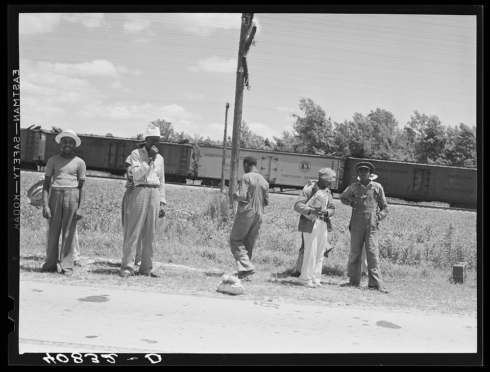 [Untitled photo, possibly related to: Migratory agricultural workers on Route 27 trying to "hitch" north with the potato…