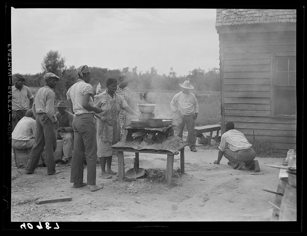 Over this stove, cooking is done for the thirty five migrants that stay in this house in the background. Near Old Trap…