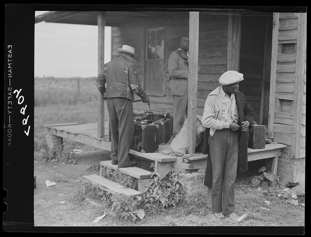 Florida migrants getting luggage ready to move on from North Carolina to Onley, Virginia. Sourced from the Library of…