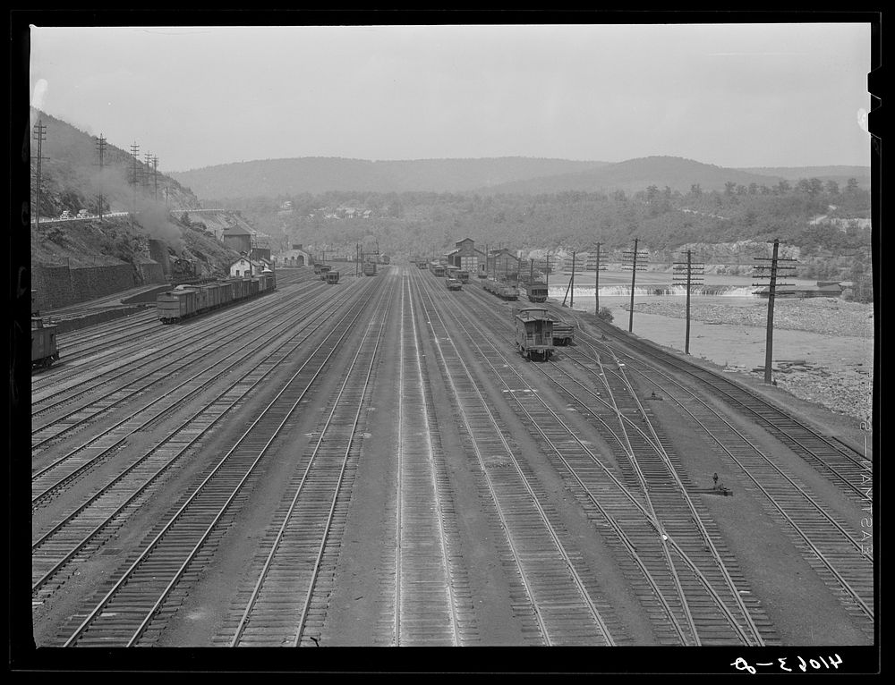 Railroad yard of the Lehigh Valley Railroad along the bank of the Lehigh River at Mauch Chunk, Pennsylvania. Sourced from…