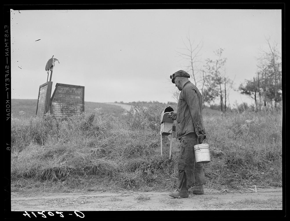 Mr. Ralph Reitz, miner and farmer, member of Tri-County Farmers Co-op Market at Du Bois, Pennsylvania, stops at mail-box on…
