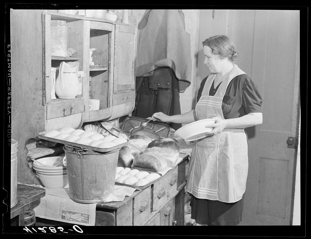Mrs. Ralph Reitz, member of the Tri-County Farmers Co-op Market at Du Bois, Pennsylvania preparing baked goods for market at…