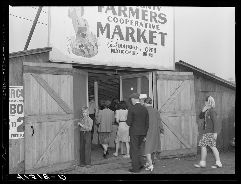 [Untitled photo, possibly related to: Customers at the entrance of the Tri-County Farmers Co-op Market in Du Bois…