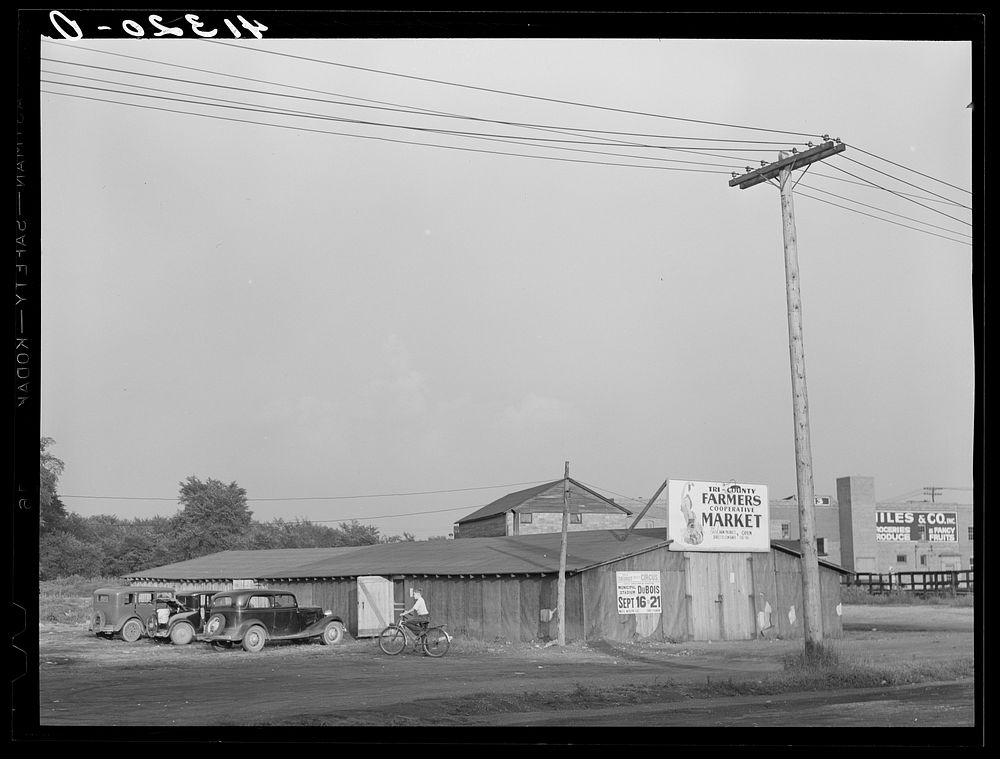 Wooden structure housing the Tri-County Farmers Co-op Market at Du Bois, Pennsylvania. They hope in time to be able to erect…