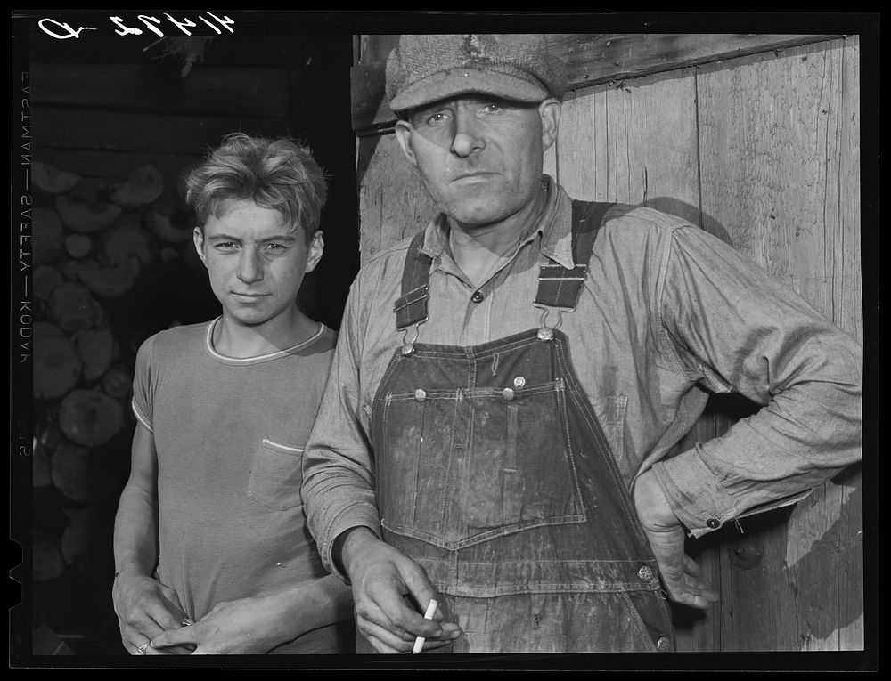 Mr. Thomas Templer and his son. A FSA (Farm Security Administration) client living in the submarginal area of Sugar Hill…