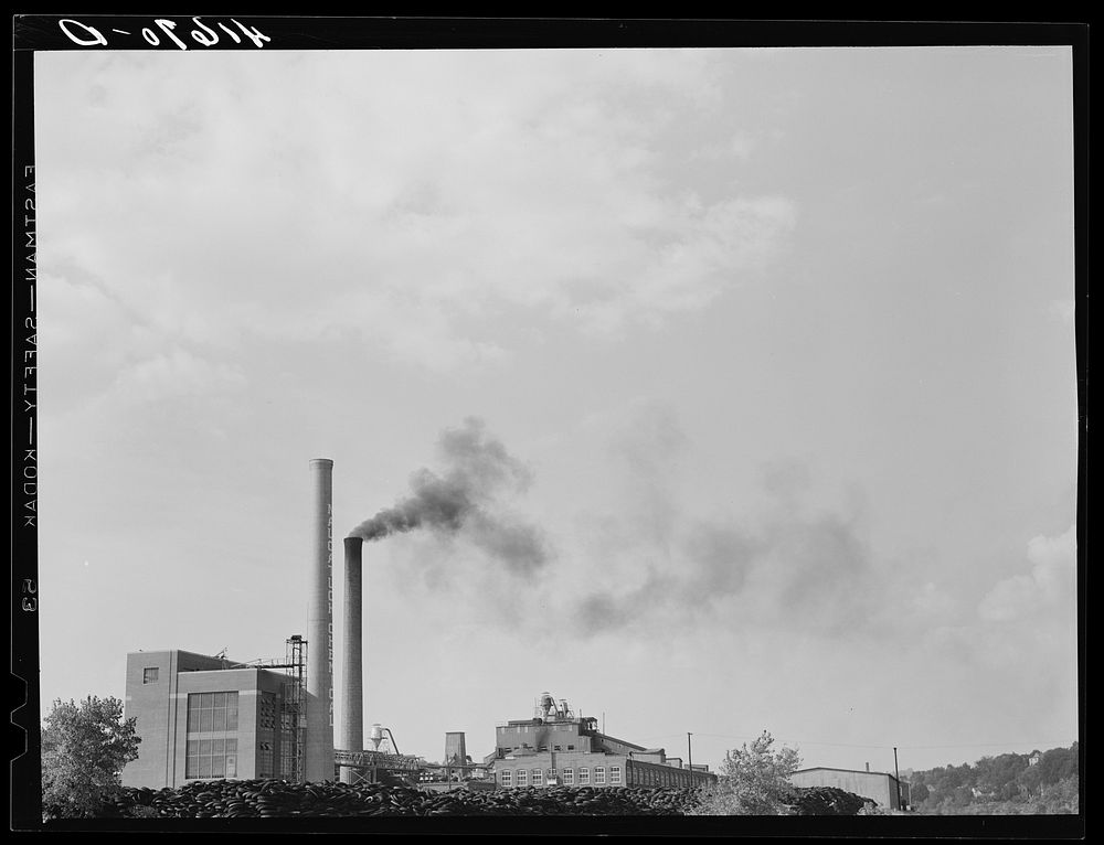 The Naugatuck Chemical Company with piles of old rubber tires. Naugatuck, Connecticut. Sourced from the Library of Congress.