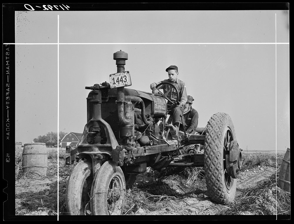 Tractor-drawn potato digger in a field near Caribou, Maine. Sourced from the Library of Congress.