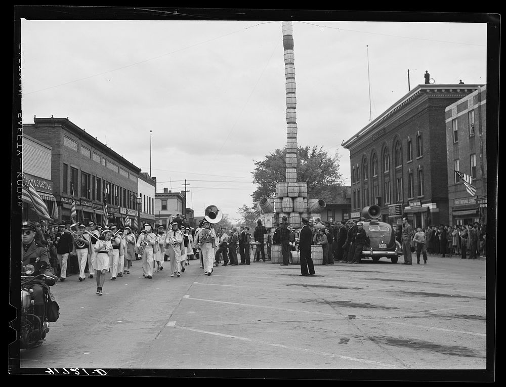 [Untitled photo, possibly related to: The school band parading on the main street of Presque Isle, Maine, in celebration of…