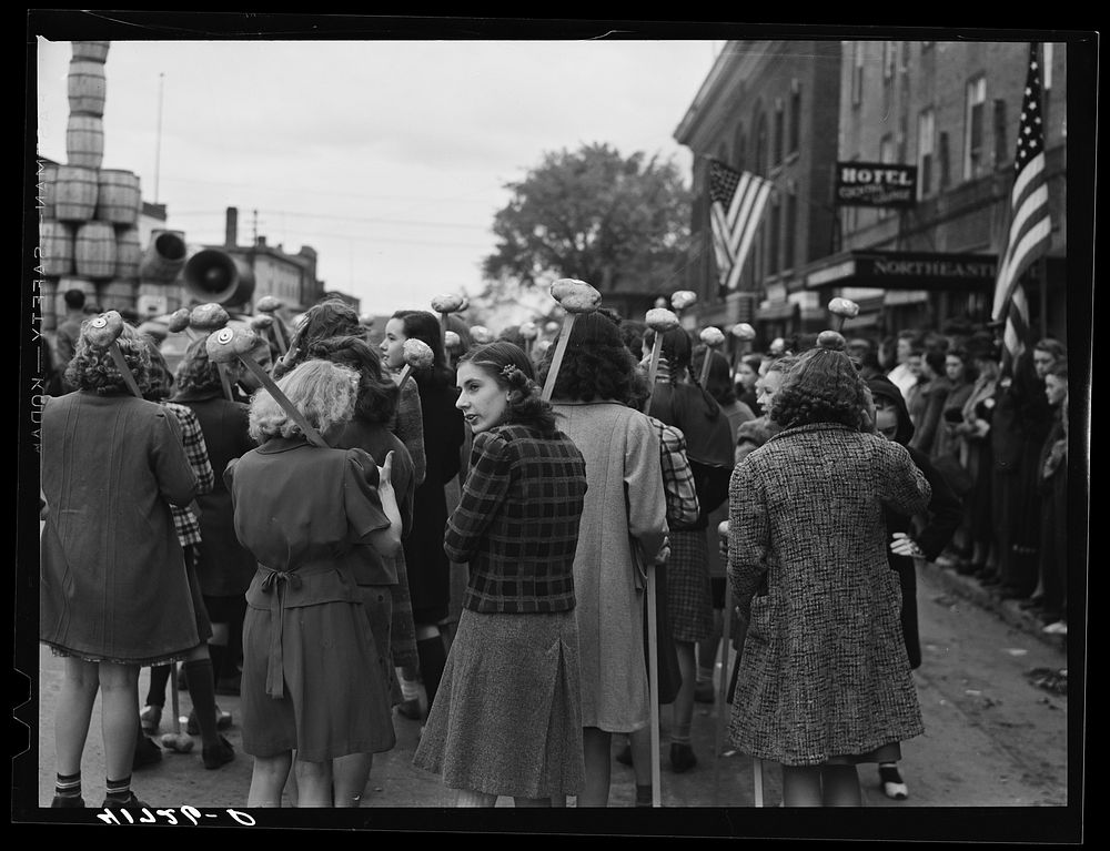 [Untitled photo, possibly related to: Schoolgirls carrying Aroostook potatoes on sticks as part of the parade on the day of…