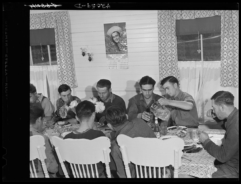 The foremen and tractor operators of the Woodman Potato Company at lunch.  Near Caribou, Maine. Sourced from the Library of…