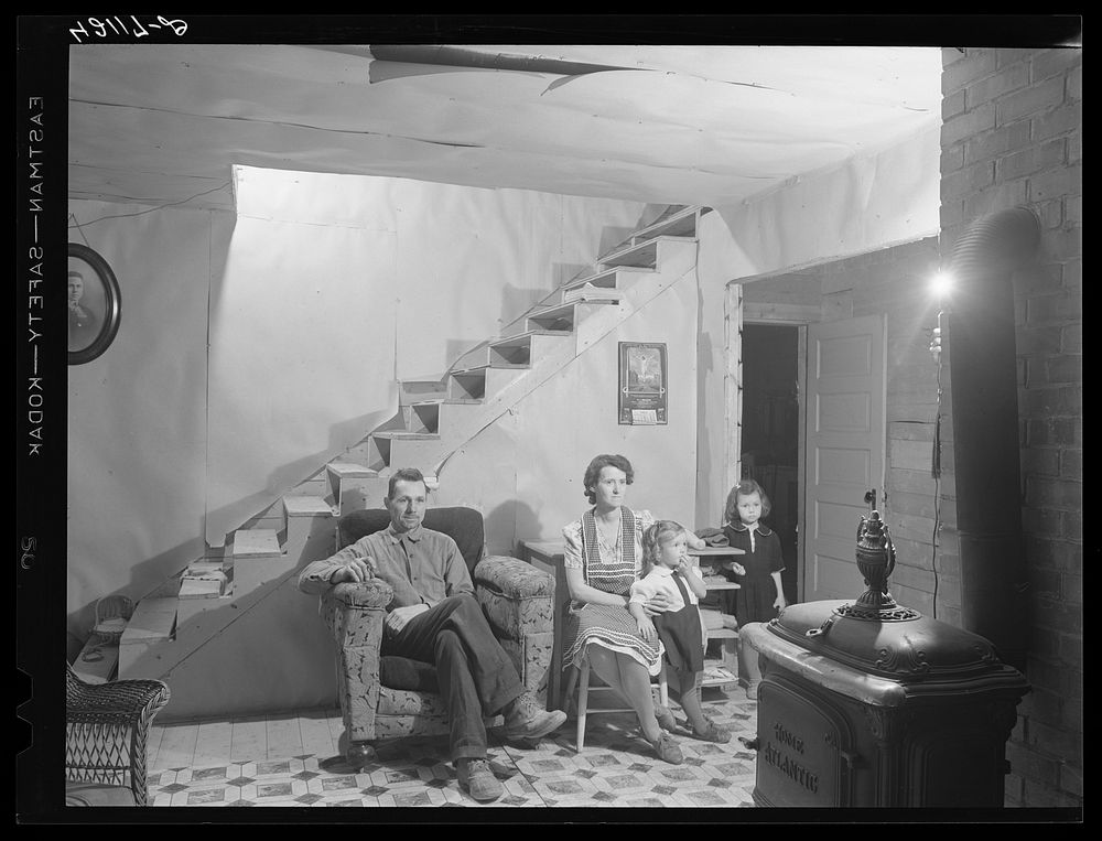 [Untitled photo, possibly related to: Mr. and Mrs. Lindore Labbee and their children in their newly-built home. Mr. Labbe…
