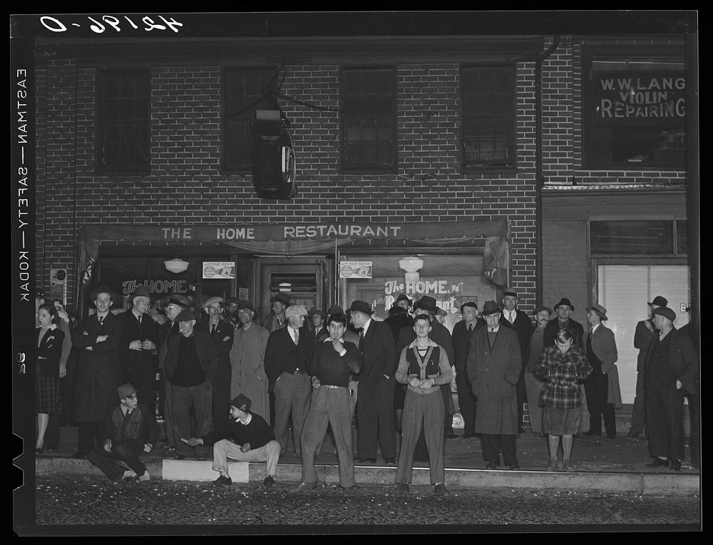 Crowds gathered around the "Norwich Express" newspaper office listening to the election returns. Norwich, Connecticut.…