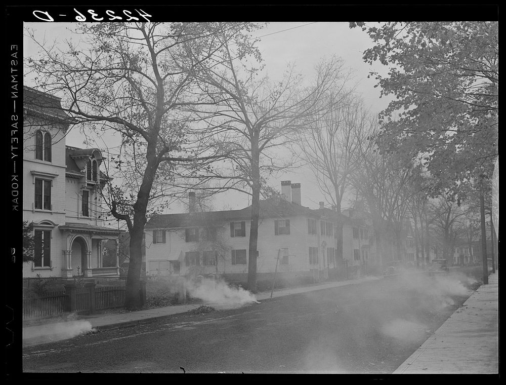 Burning the autumn leaves on Broadway. Norwich, Connecticut. Sourced from the Library of Congress.