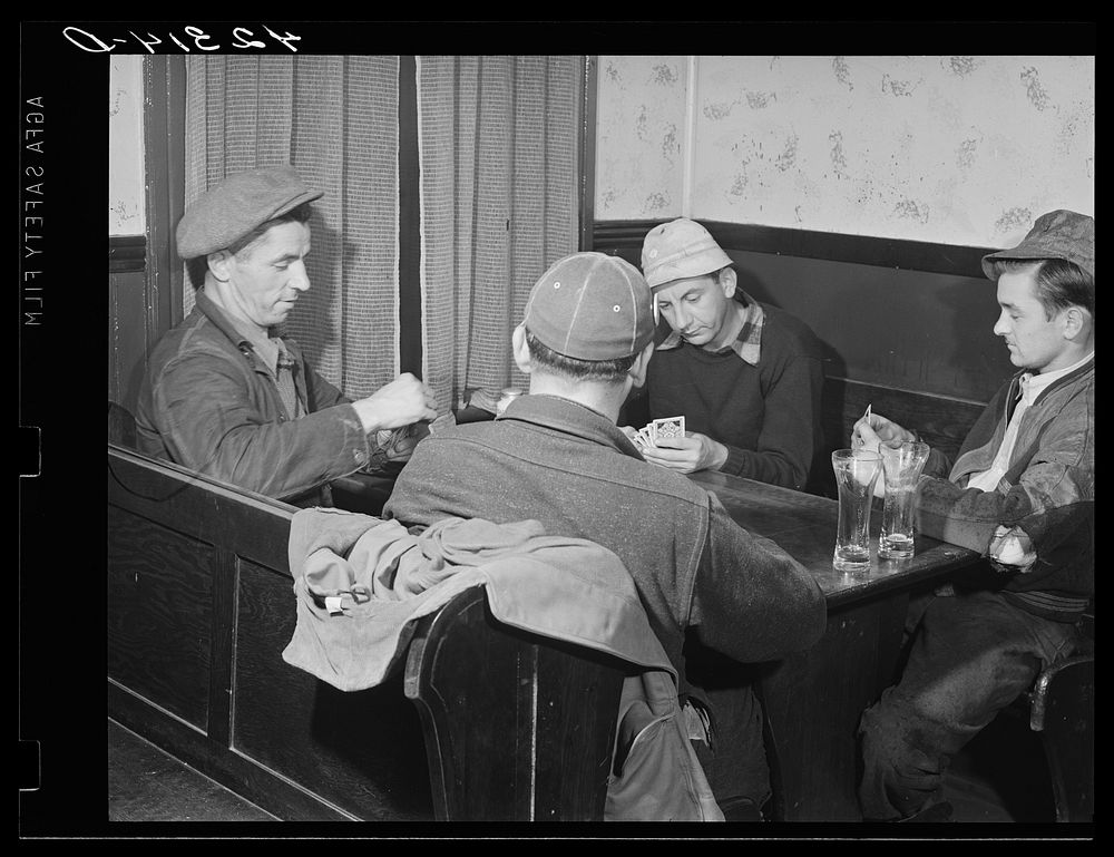 A game of cards in "Art's Sportsman's Tavern" on a rainy day in Colchester, Connecticut. Sourced from the Library of…