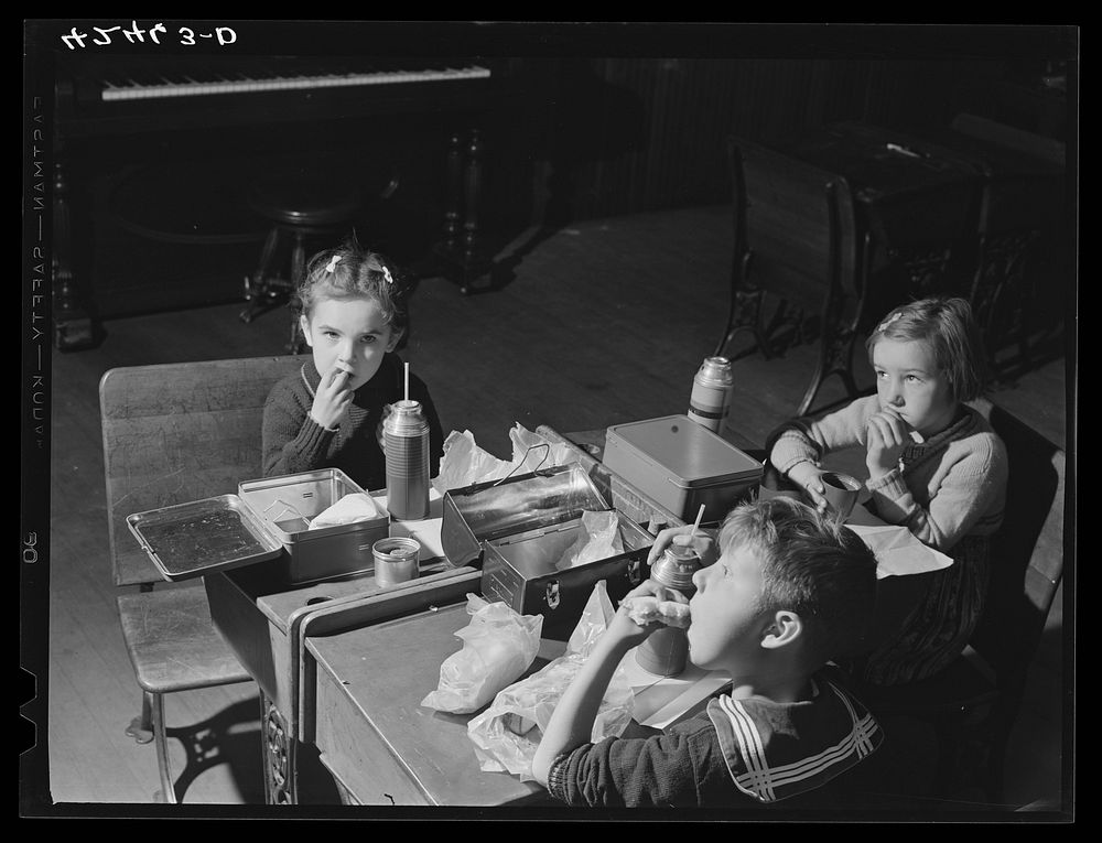 Children having lunch in the schoolhouse in Ledyard, Connecticut. Sourced from the Library of Congress.
