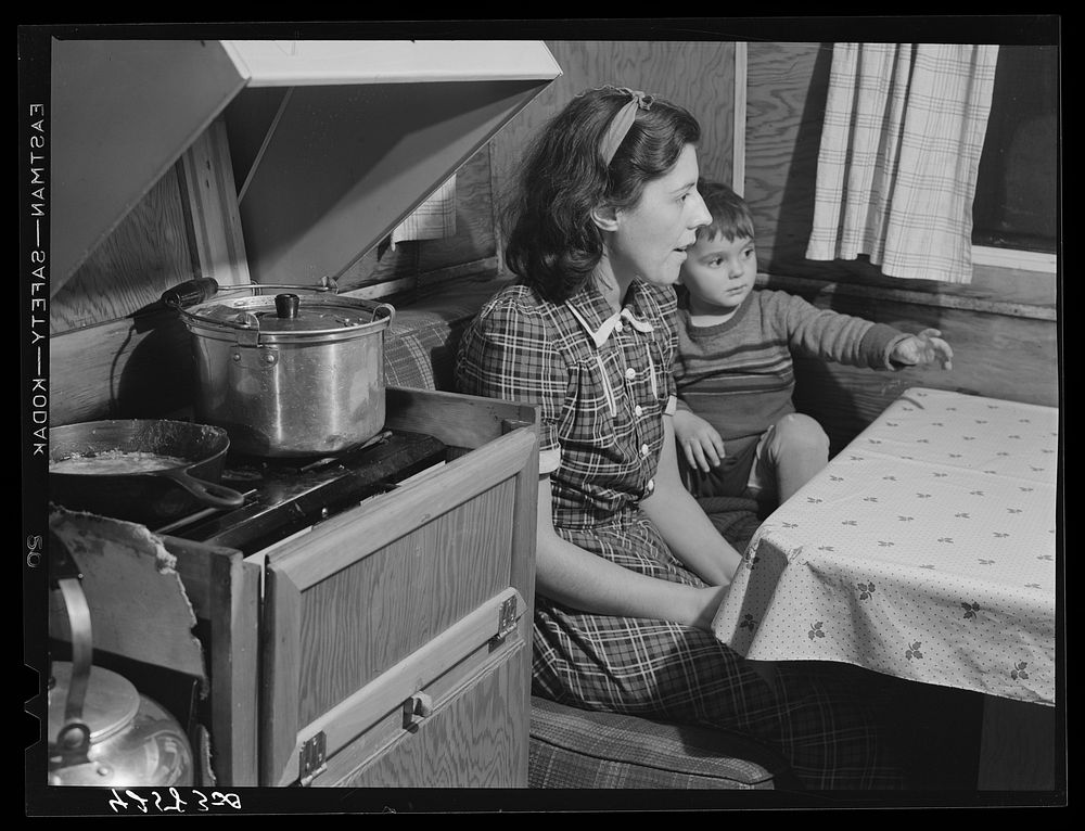 Mrs. Burton and her child, inside trailer (see caption #42581-D). Bath, Maine. Sourced from the Library of Congress.