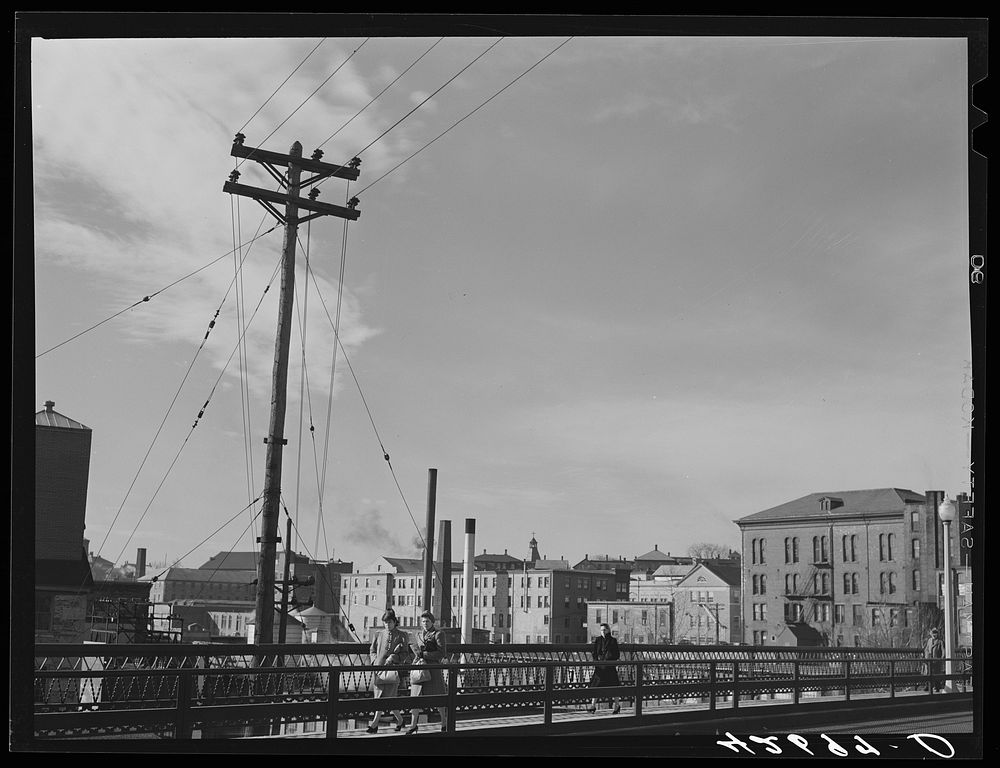 [Untitled photo, possibly related to: Textile mills seen from a bridge in Woonsocket, Rhode Island]. Sourced from the…
