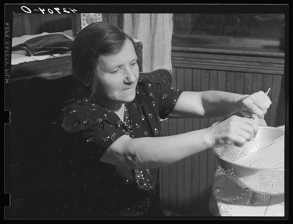 An Italian farm woman near Providence, Rhode Island preparing spaghetti. Sourced from the Library of Congress.