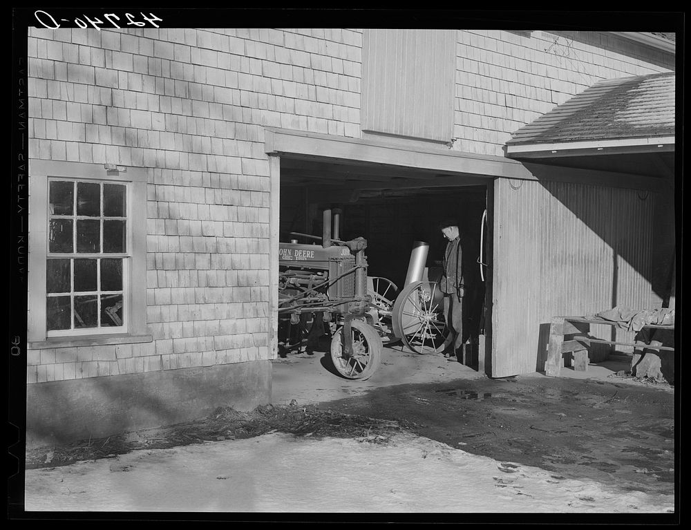 Equipment shed of Mr. Peabody, FSA (Farm Security Administration) client near Newport, Rhode Island. All the machinery is…
