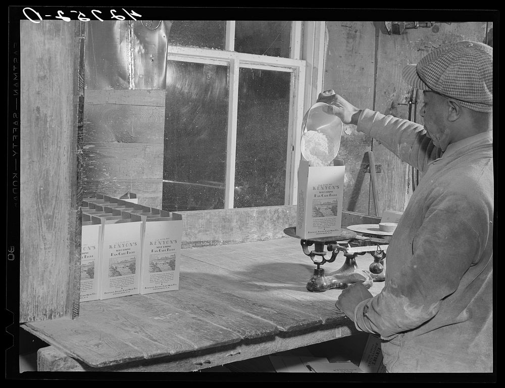 [Untitled photo, possibly related to: Filling pound boxes of Kenyon's pancake flour at the old mill in Usquepaugh, Rhode…