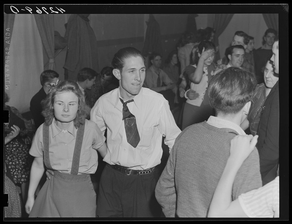 At a Saturday night square dance in Clayville, Rhode Island. Sourced from the Library of Congress.