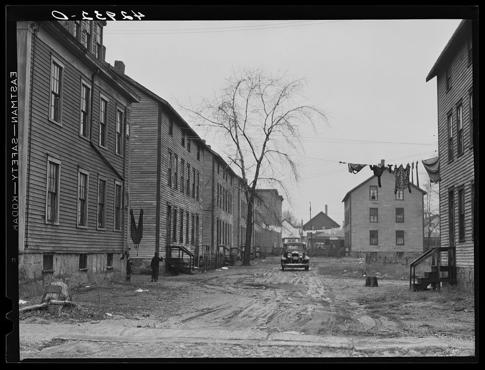 Houses in slum area in New Bedford, Massachusetts. Sourced from the Library of Congress.
