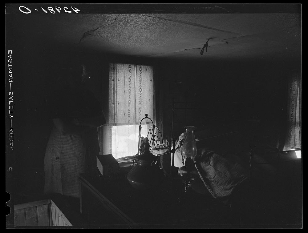 [Untitled photo, possibly related to: Woman in dilapidated old house in the Mount Washington district of Beaver Falls…