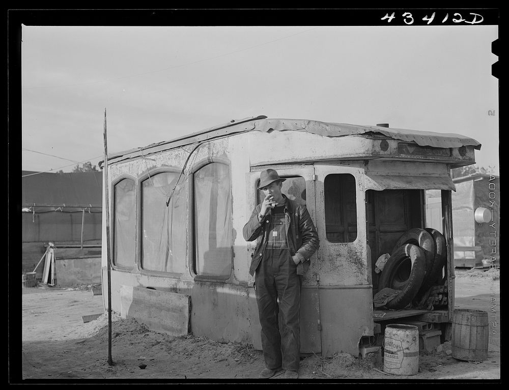 Construction worker from Fort Bragg. He lives in this homemade bunkhouse in Manchester, North Carolina. Sourced from the…