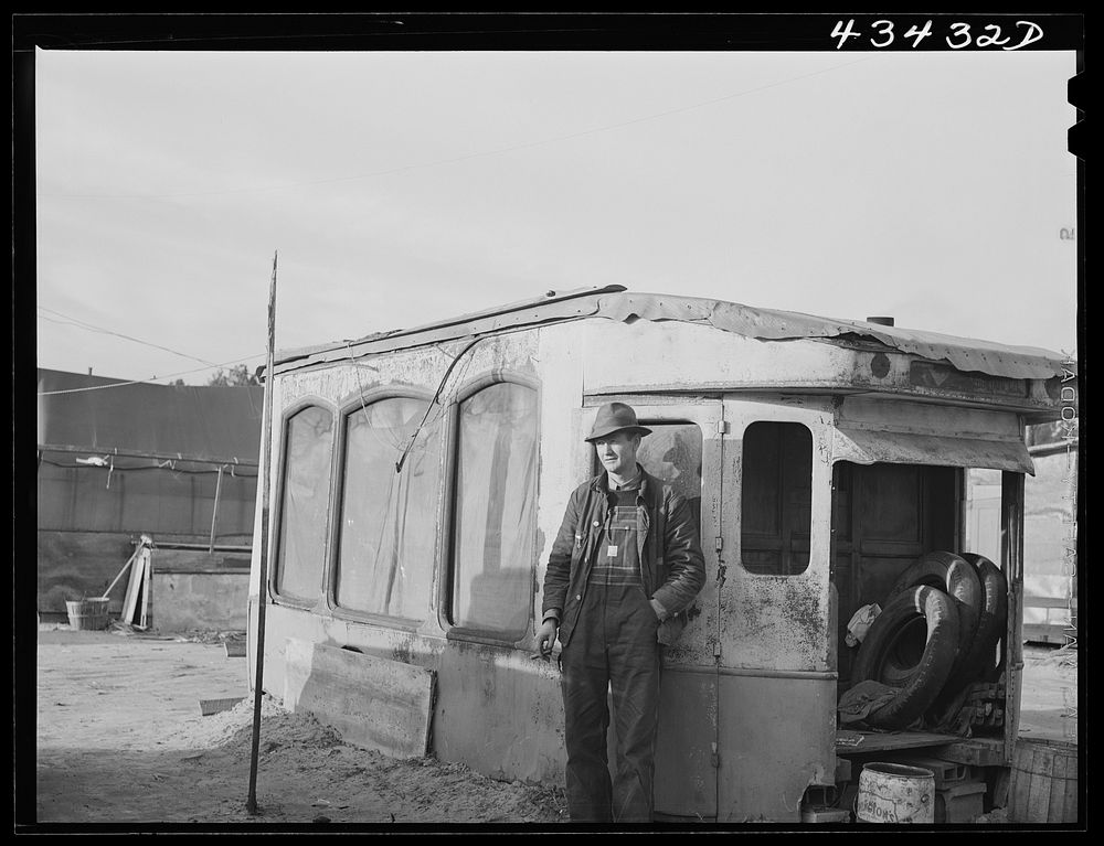 [Untitled photo, possibly related to: Construction worker from Fort Bragg. He lives in this homemade bunkhouse in…