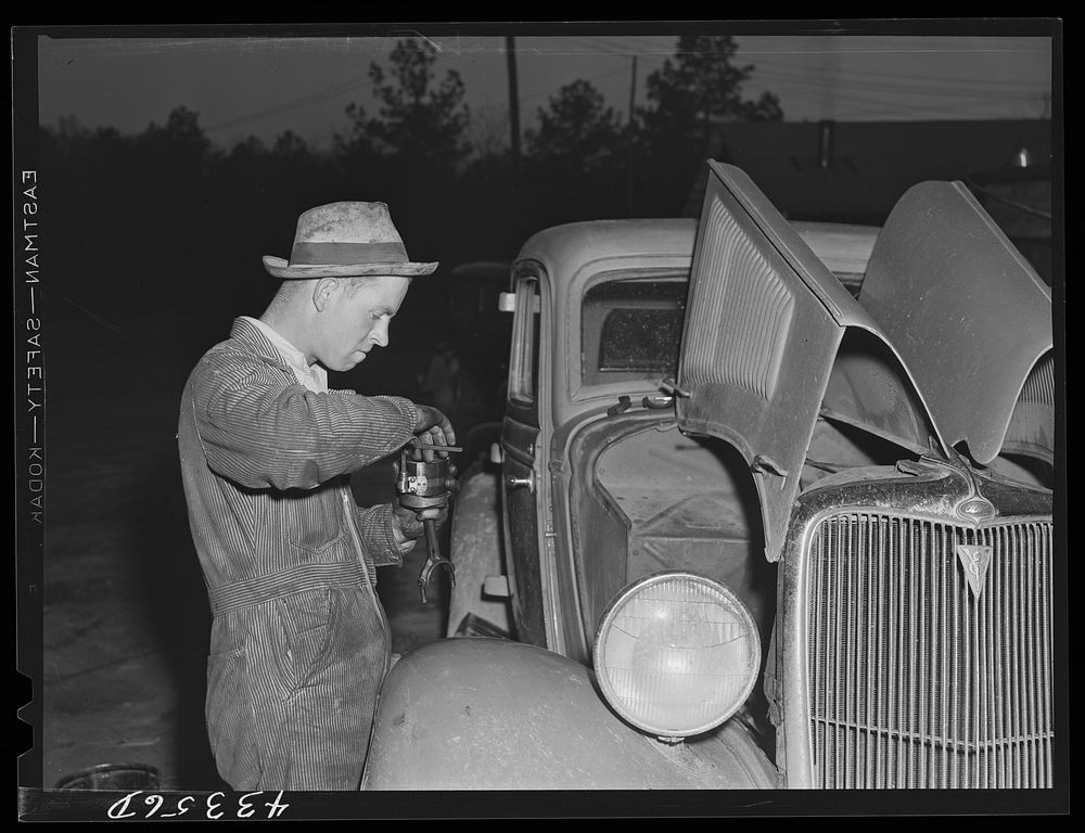 A major motor repair job at one of the settlements of workers from Fort Bragg. Near Manchester, North Carolina. Sourced from…