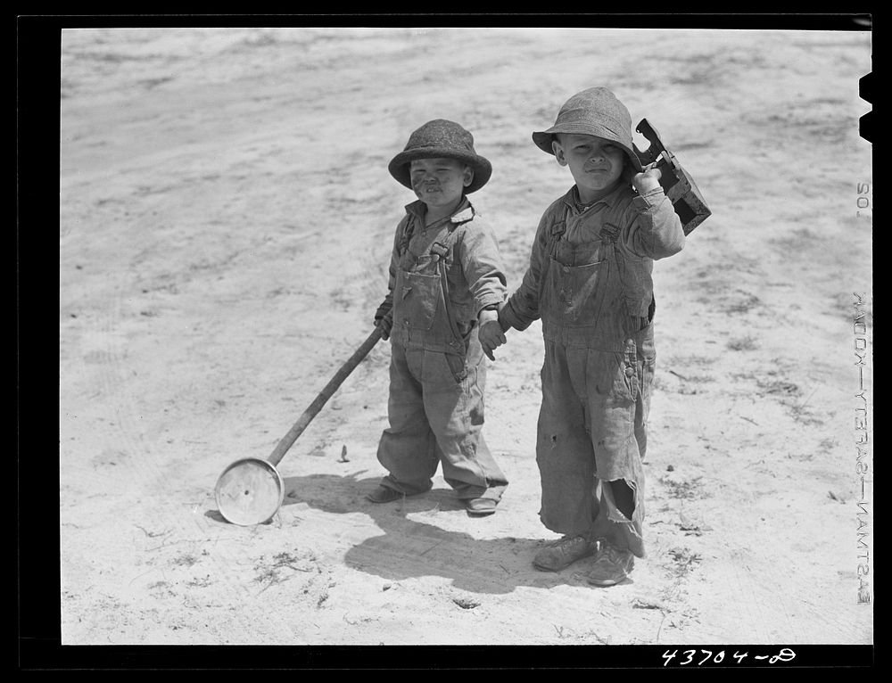 Two children at Hazlehurst Farms Inc.. Sourced from the Library of Congress.