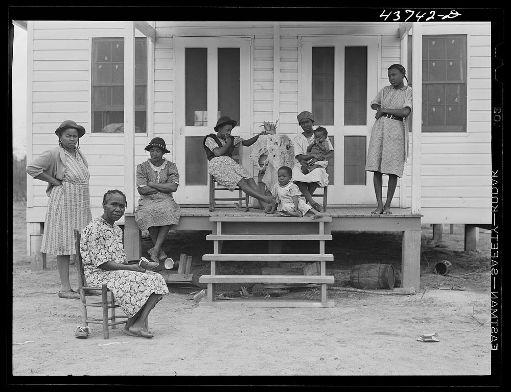 family and friends at one of the prefabricated houses for Negroes at Hazlehurst Farms Inc., Hazlehurst, Georgia. Sourced…