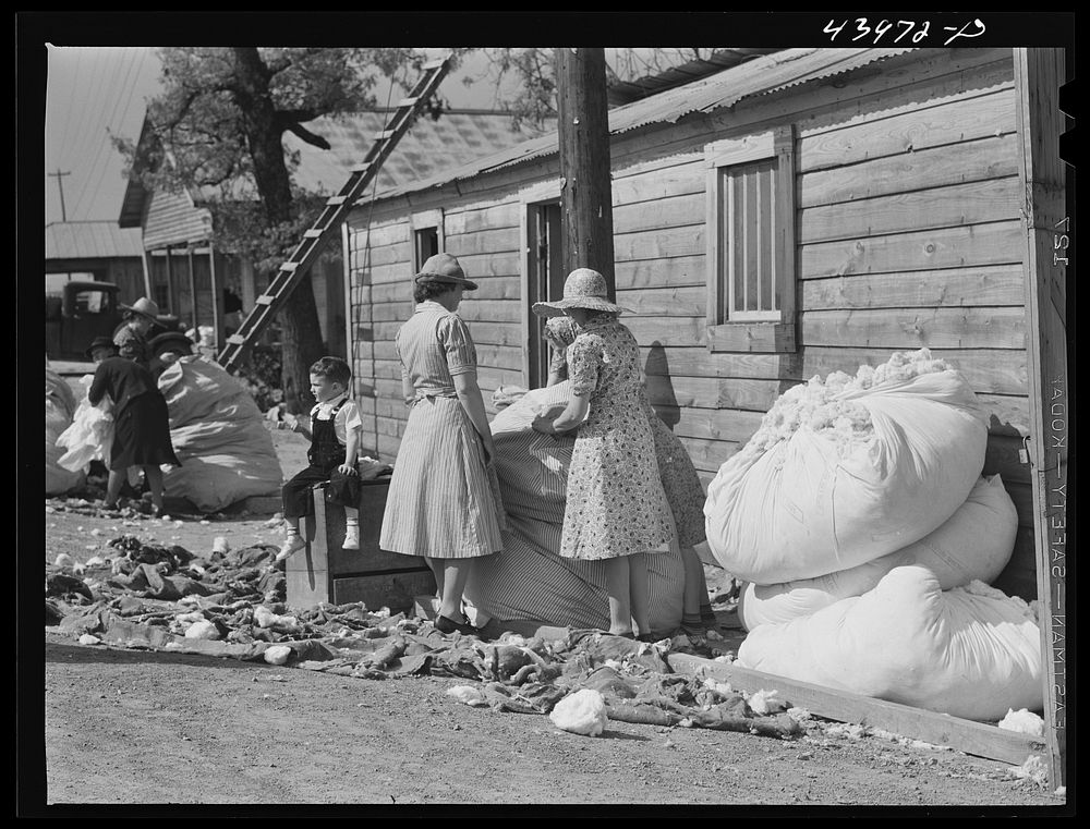 Making matresses from surplus cotton in Centralhatchee. Heard County, Georgia. Sourced from the Library of Congress.