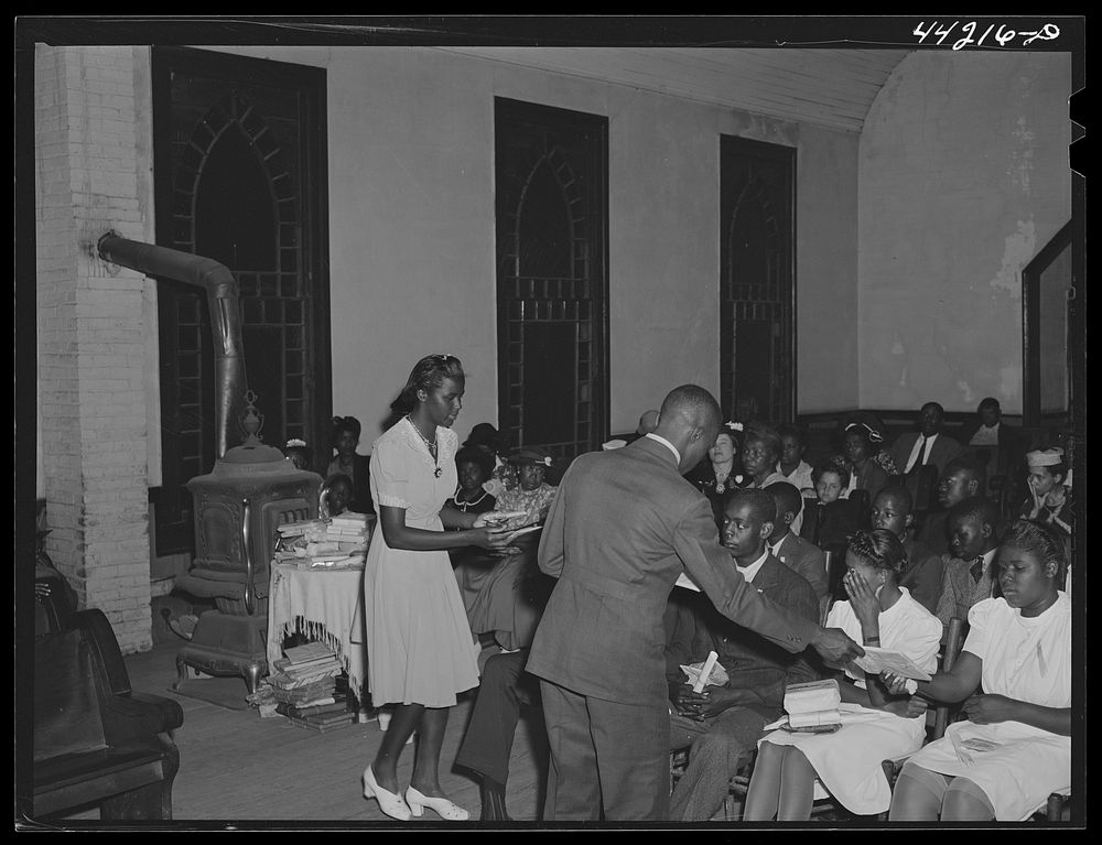 Giving presents to the graduates at the graduation exercises. Union Point  high school. Union Point, Greene County, Georgia.…
