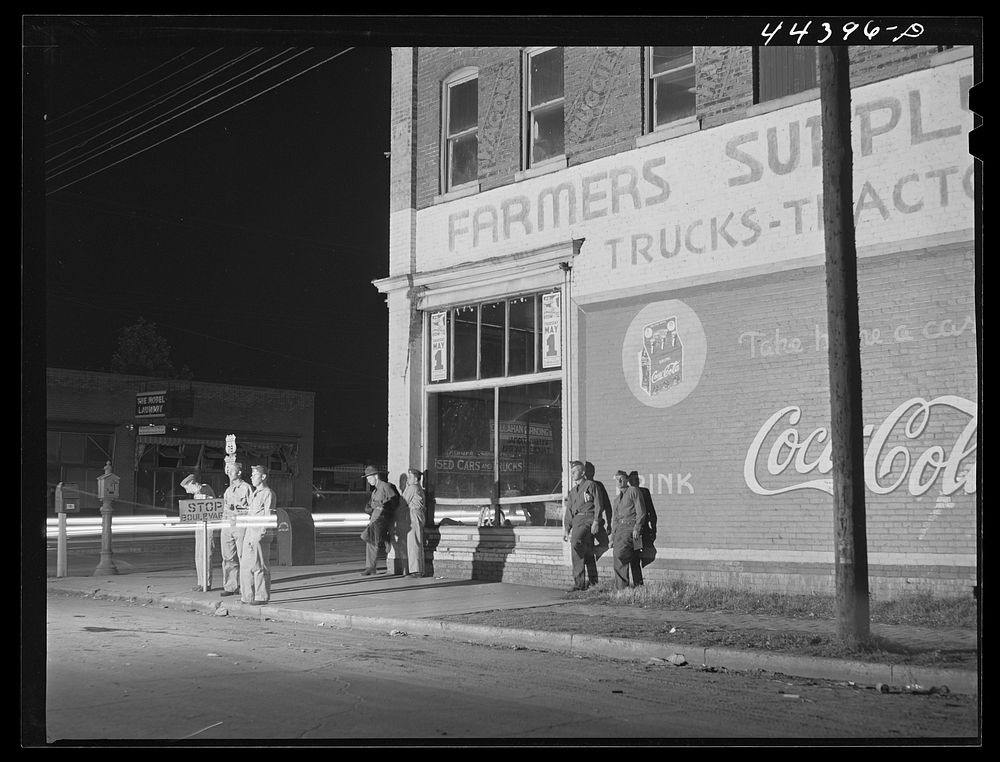 [Untitled photo, possibly related to: Soldiers from a nearby Army camp waiting for a bus in Anniston, Alabama]. Sourced from…