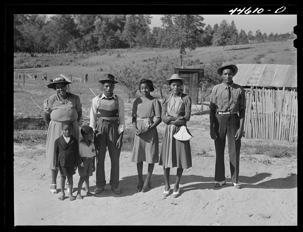 Family who has just come back from a funeral. Greene County, Georgia. Sourced from the Library of Congress.