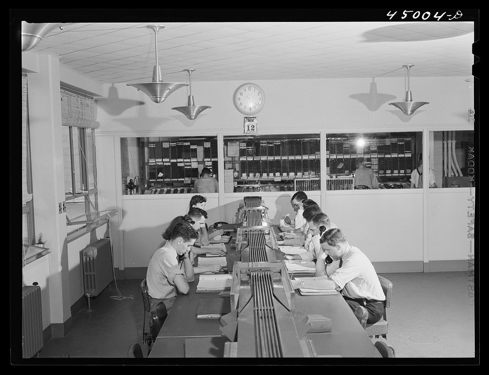 In the ticket reservations department of one of the airliners. Washington, D.C. municipal airport. Sourced from the Library…
