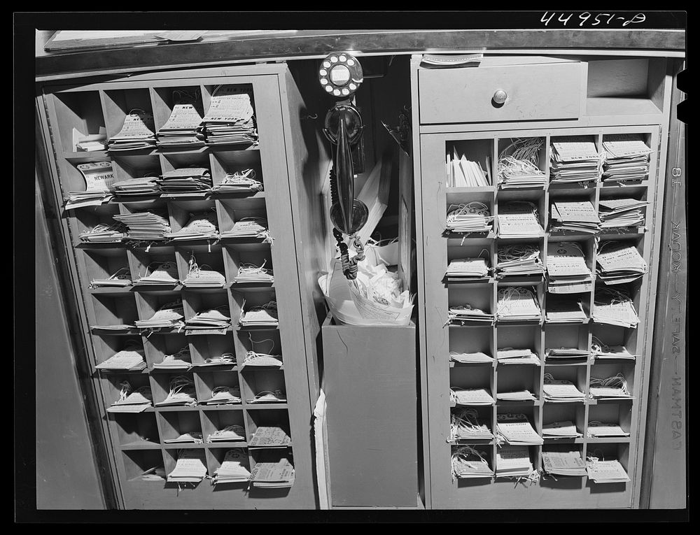Baggage tags behind the ticket counter. Municipal airport, Washington, D.C.. Sourced from the Library of Congress.