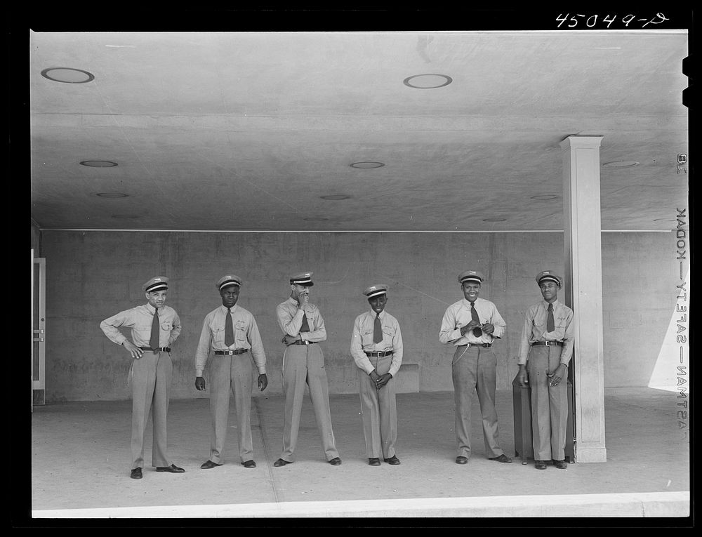 "Skycaps" at the entrance to the administration building. Municipal airport, Washington, D.C.. Sourced from the Library of…