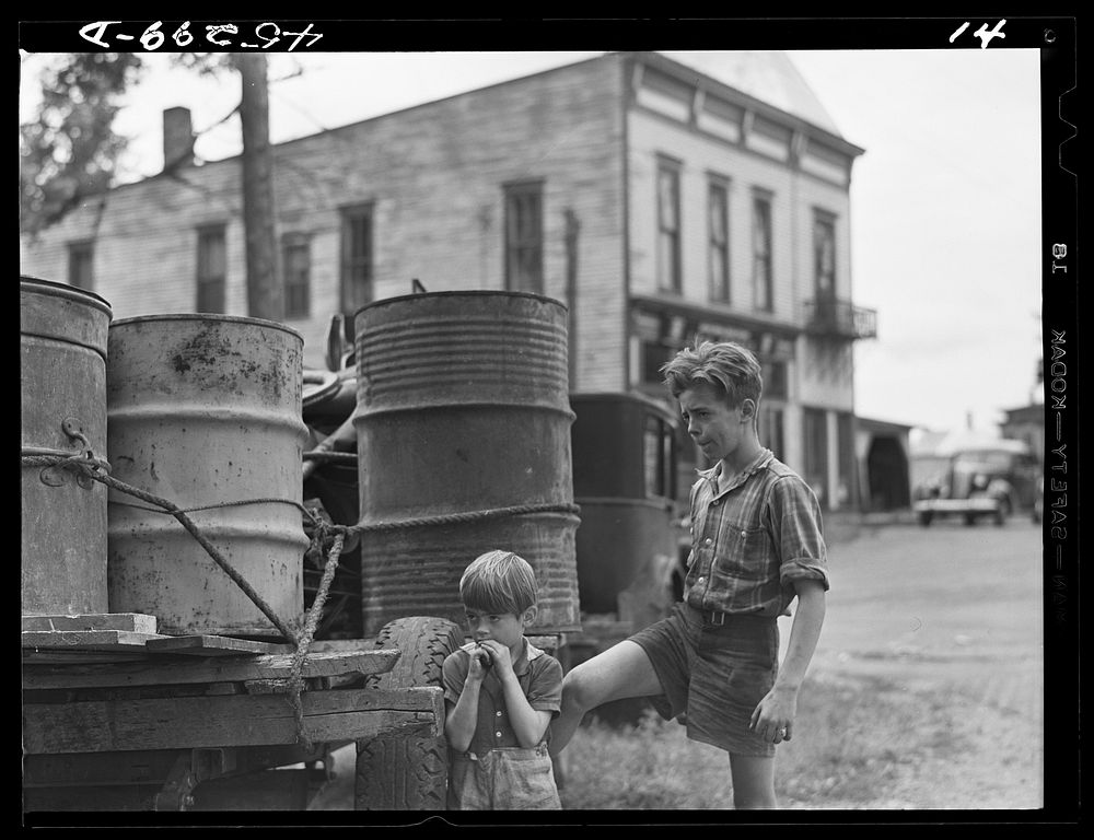 Two of the children of Mr. Earl J. Brown helping to get their last few belongings out of their farm in the Pine Camp…
