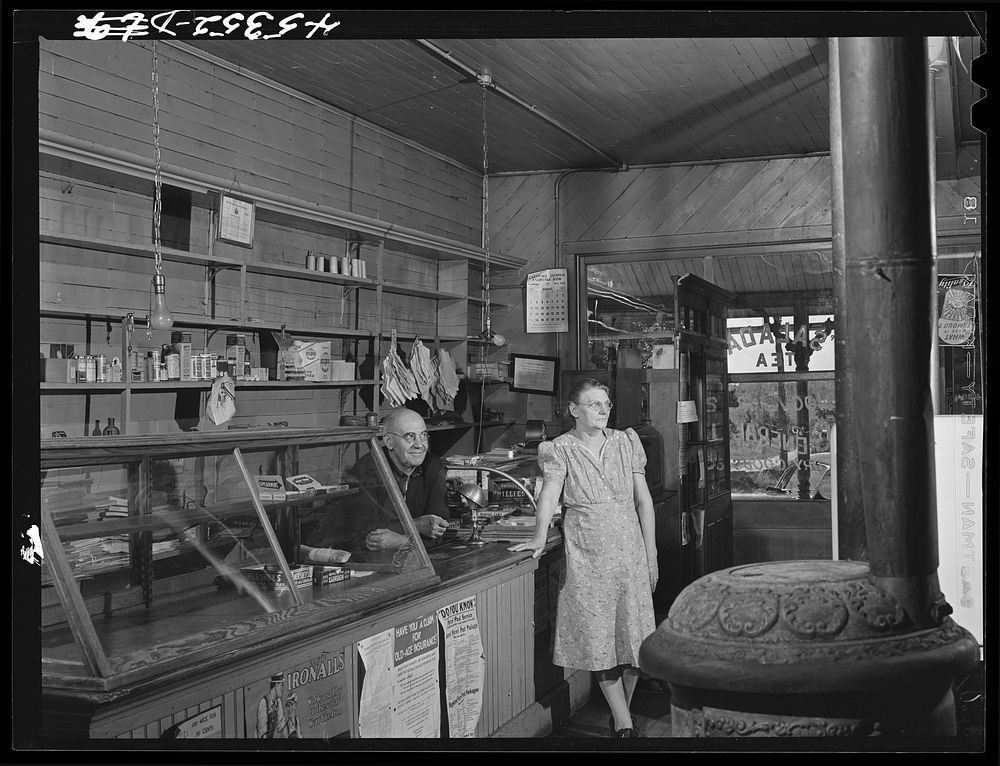 Mr. and Mrs. Merton Hoover in their store and post office in Sterlingville, New York. The Hoovers are moving out of the Pine…