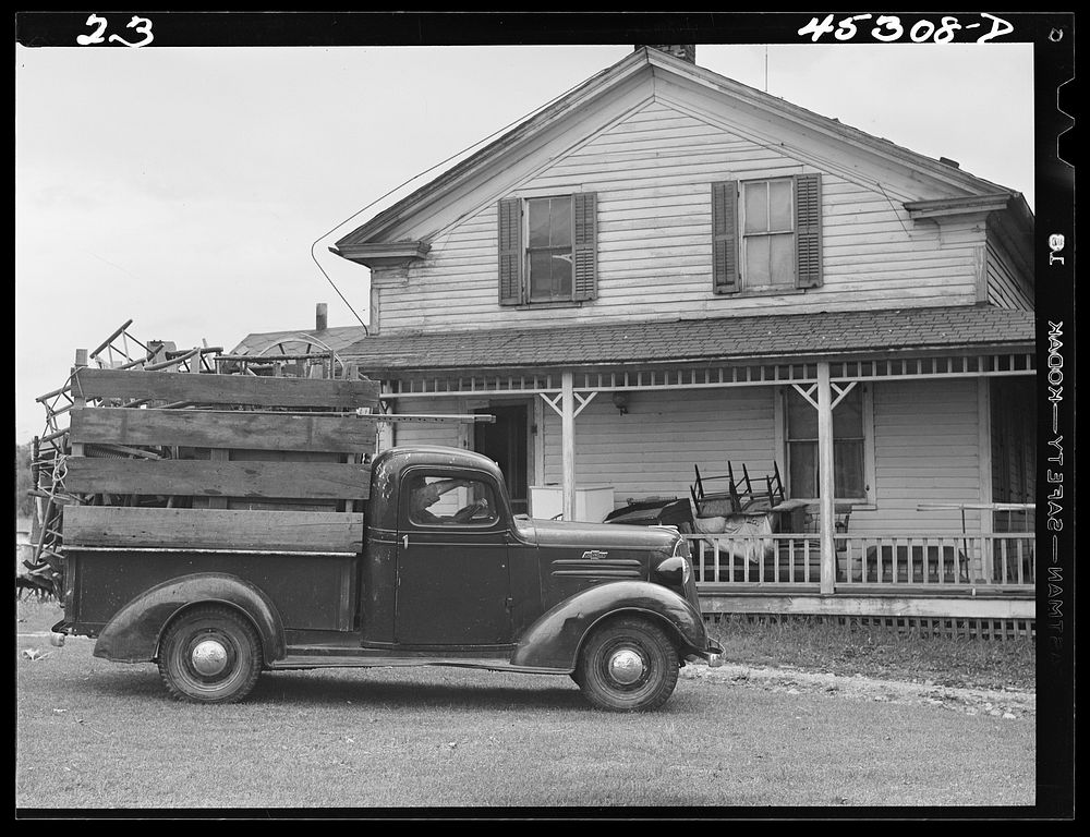 Truck load of household goods at a farm in the Pine Camp expansion area. Most farm families needed several truckloads a day…