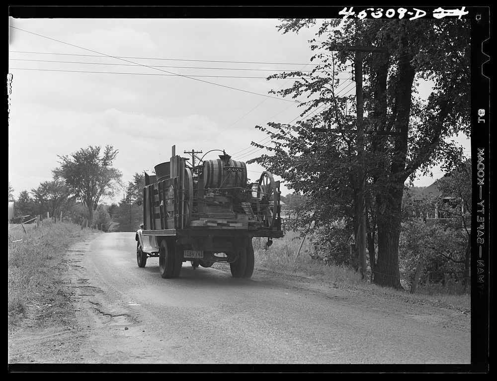 One of the many trucks to be seen carrying a farmer's belongings out of the Pine Camp expansion area. Near Pine Camp, New…