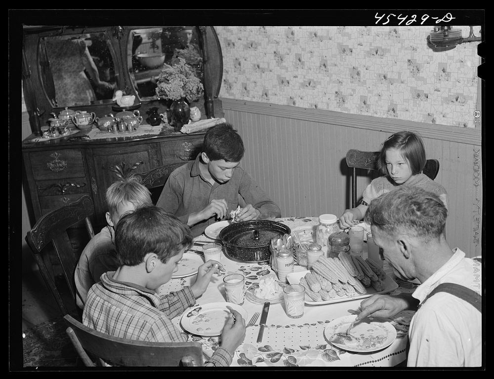 [Untitled photo, possibly related to: Having dinner at the home of Ray Lyman, FSA (Farm Security Administration) client near…