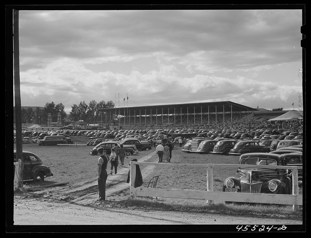 [Untitled photo, possibly related to: Grandstand and parked cars at the Rutland Fair. Vermont]. Sourced from the Library of…